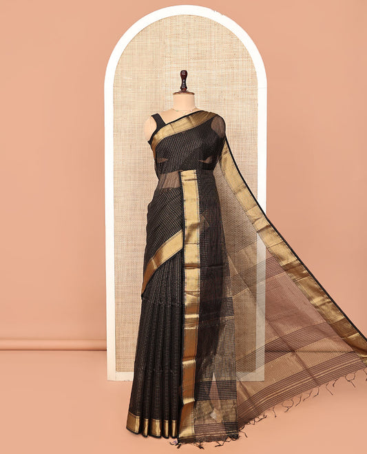 Black Maheshwari Cotton Saree, Gleamed Up with Micro-Checked Design All Over Its Body, Highlighted by Traditional Zari Border, Pallu Steeped with Zari Stripes, and Paired with a Matching Blouse