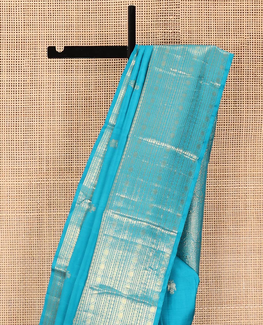 Blue Kanchipuram Silk Saree, Decorated with Iruthalai Pakshi Buttas All Over Its Body, Highlighted by a Zari Border of Puli Nagam, Manga, Kamalam, and Kodi Visiry Designs, Pallu of Human Figurines, and Paired with a Matching Blouse