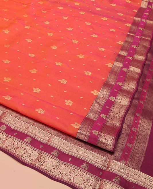 Orange Vasundhara Lite Silk Mix Saree, Accentuated with Zari Buttas, Complemented by a Contrast Border of Thilakam Mokku, and Kodi Visiry Designs, Pallu of Floral Jaal Designs, and Paired with a Contrast Blouse