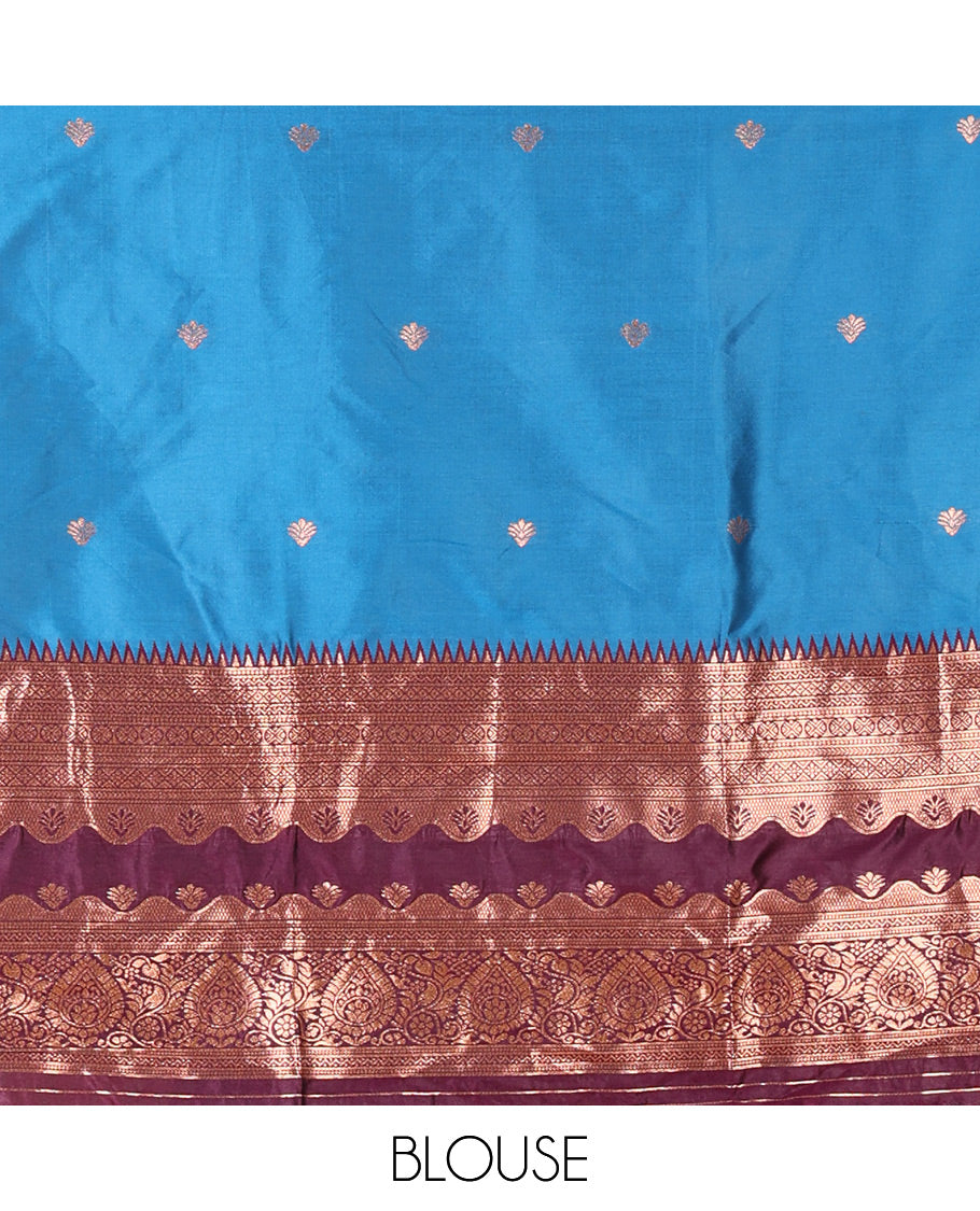 Blue-Purple Semi-Banarasi Half-Saree Mesmerized with Zari Buttas on Its Skirt, Complemented by a Contrast Traditional Zari Temple Rettai Pettu Border, Paired with a Matching Blouse, and a Satin Georgette Embroidered Scallop Dhavani