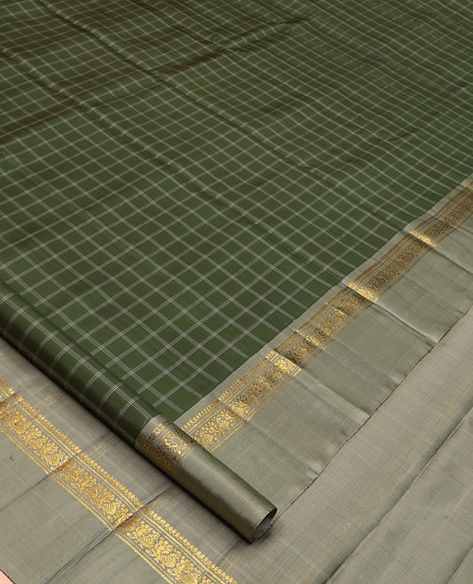 Olive Kanchipuram Silk Saree, Enthralled with Medium-Sized Checked Design All Over Its Body, Complemented by a Contrast Kal Eragina Border of Thilakam Mokku, Banaras, Muthu, and Mayil Designs, Subtly Striped Pallu, and Paired with a Contrast Blouse