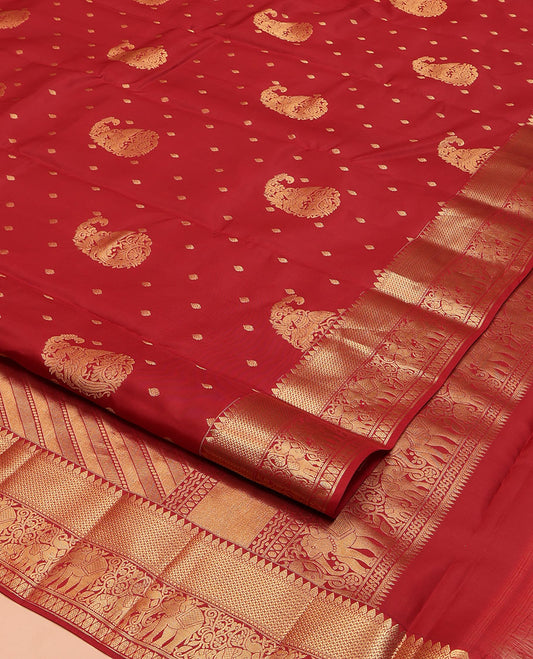 Red Vasundhara Lite Silk Mix Saree, Ornamented with Manga Zari Buttas on Its Body, Highlighted by a Zari Border of Rekku, Yaanai, and Rudraksham Designs, Pallu of Diagonal Designs, and Paired with a Matching Blouse