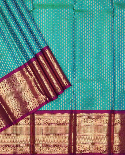 Blue puresilk halfsaree, zari buttas skirt, contrast border, blouse of thilakam mokku,banaras,kamalam, and lavangam designs, and intricate dhavani