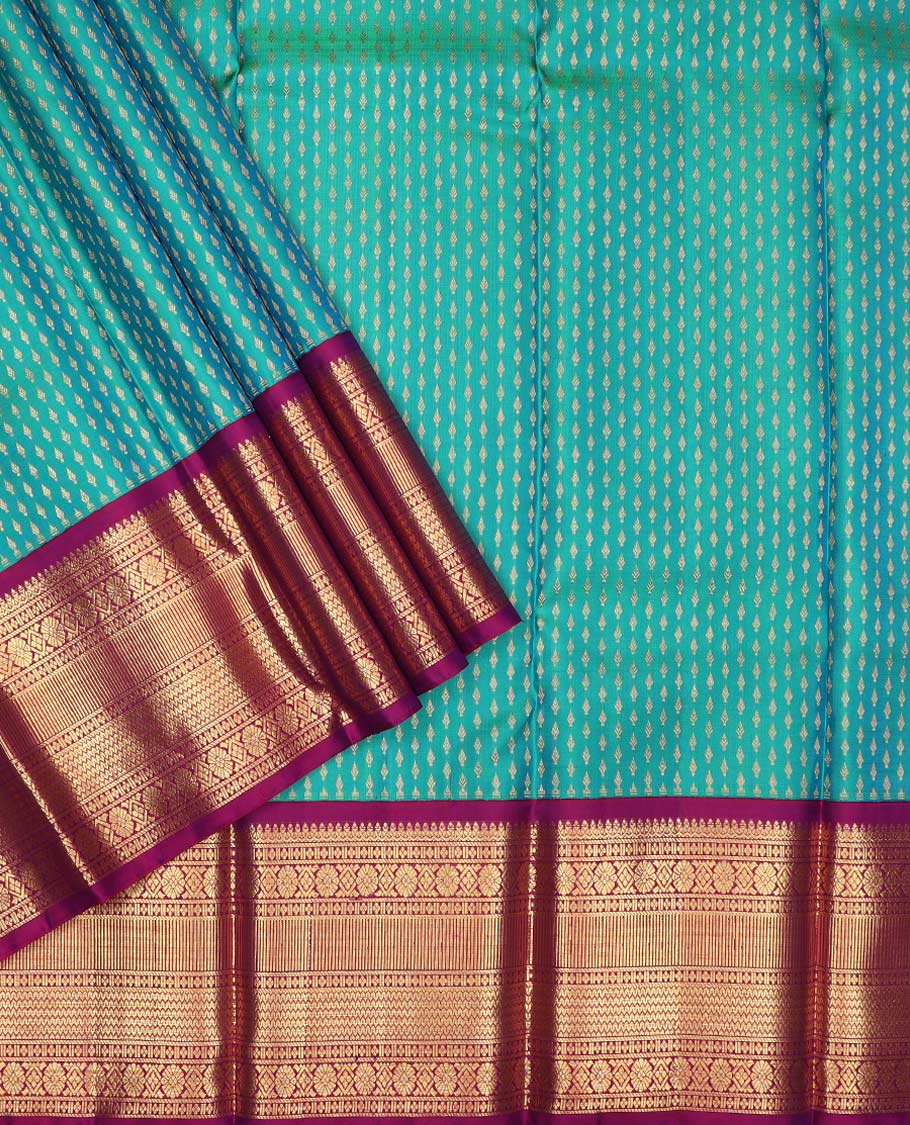 Blue puresilk halfsaree, zari buttas skirt, contrast border, blouse of thilakam mokku,banaras,kamalam, and lavangam designs, and intricate dhavani