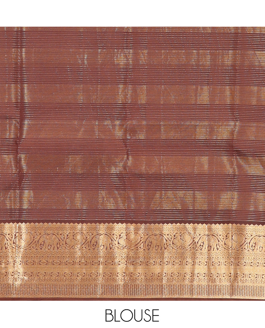 Sandal Vasundhara Silk Saree, Sparsely Sparkled with Zari Checks and Mayil Buttas, a Contrast Border of Thilakam Mokku, Banaras, Neli, Mayil, Yaanai, Mayil Kann, and Ara Maadam Designs, Grand Pallu, and a Contrast Blouse