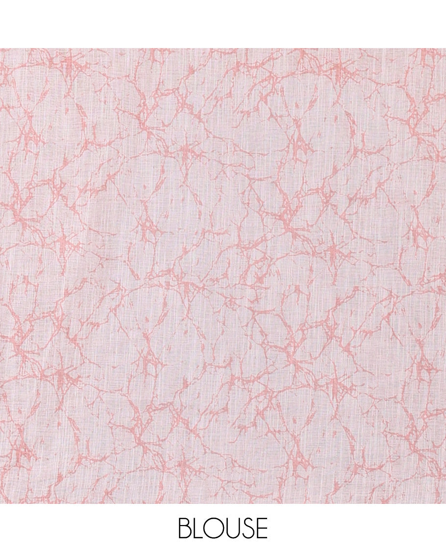 Rust shibori-dye style printed linen cotton saree, piping border, batik leaf printed pallu and a contrast batik printed blouse