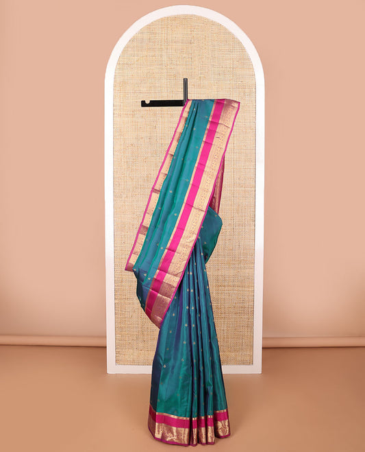 Light blue floral buttas vasundhara elite silk sare with self intricate zari design border & checkered design pallu