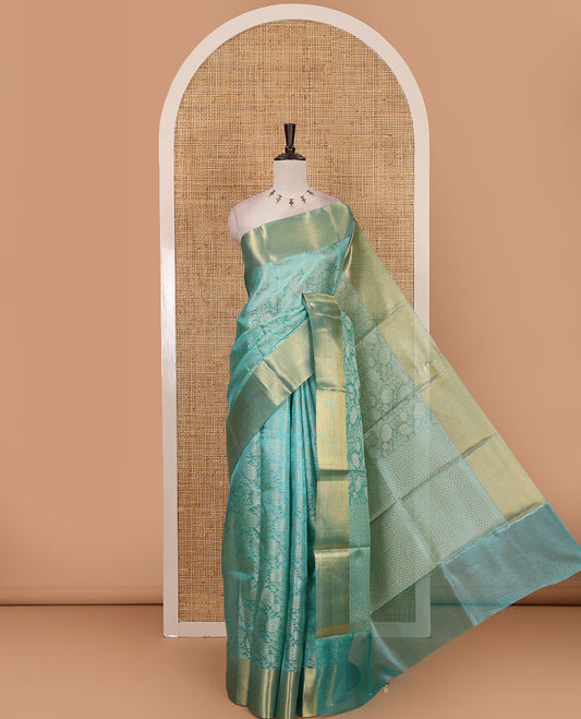 Sea green floral jaal design tissue saree, bavanji golden zari border, plain pallu & matching zari border blouse