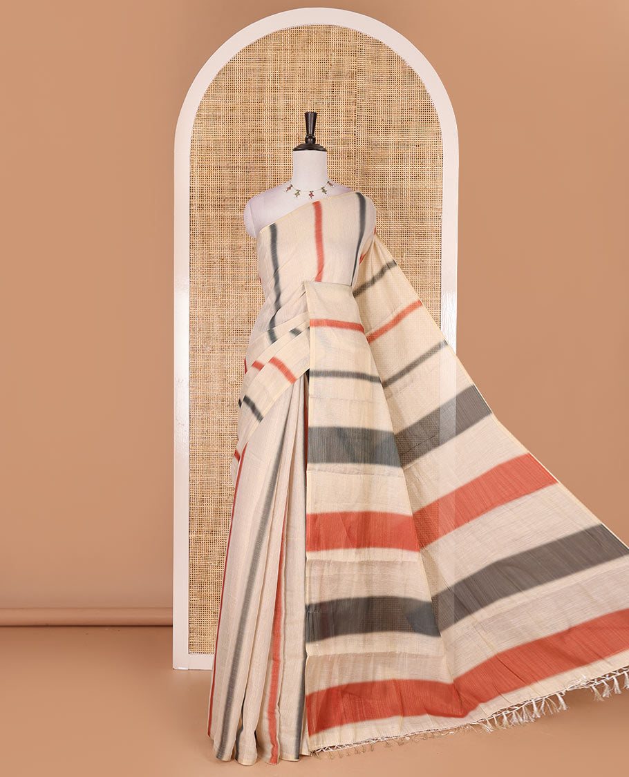 Borderless cream, colorful striped tissue saree, unique motifs printed orange color blouse
