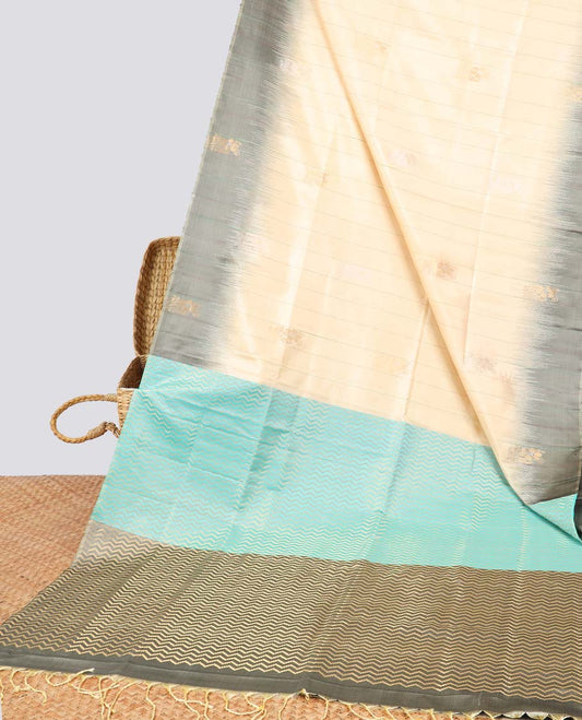 Cream floral buttas soft silk saree with contrast floral border & zig zag striped zari design pallu