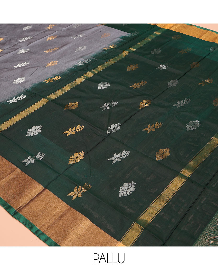 Grey Uppada Silk Saree, Subtly Sparkled with Buttas All Over Its Body, Complemented by a Contrast Bavanji Border of Zari Buttas, Pallu Steeped with Zari Buttas, and Paired with a Contrast Blouse