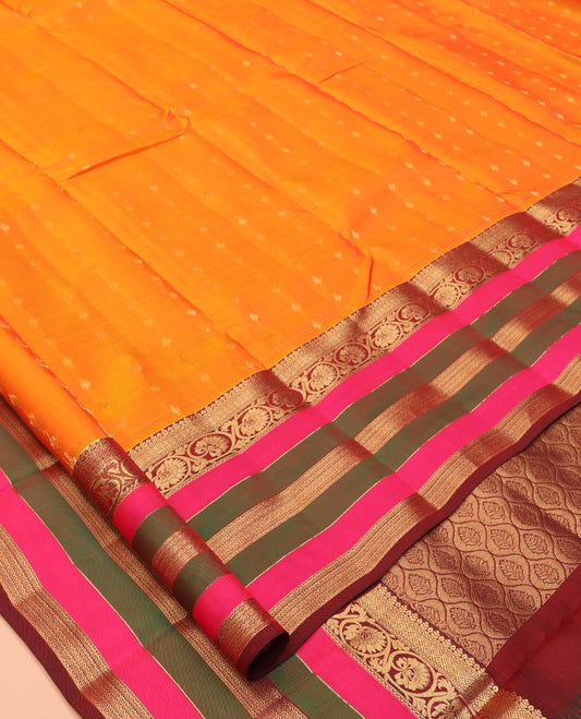Orange Vasundhara Lite Silk Mix Saree, Accentuated with Zari Buttas, a Contrast Border of Jaal, Kodi Visiry and, Neli Designs, Grand Jaal Pallu, and a Contrast Blouse