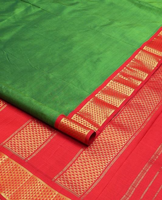 Parrot green plain nine-yard silk saree, contrast ara maadam design korvai border, and pallu of ara maadam designs