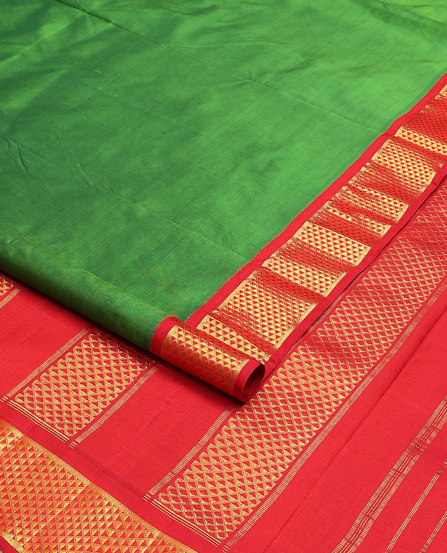 Parrot green plain nine-yard silk saree, contrast ara maadam design korvai border, and pallu of ara maadam designs