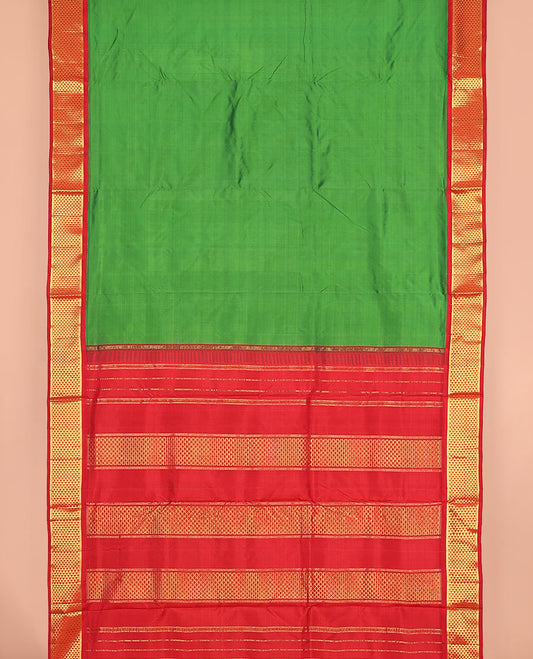 Parrot green plain nine-yard silk saree, contrast ara maadam design korvai border, and pallu of ara maadam designs