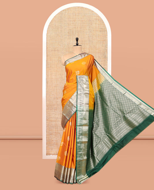 Yellow Budget Silk Saree, Artfully Detailed with Peacock-Chakram Buttas, Complemented by Contrast Traditional Zari Border, Pallu of Jaal Designs, and Contrast Blouse