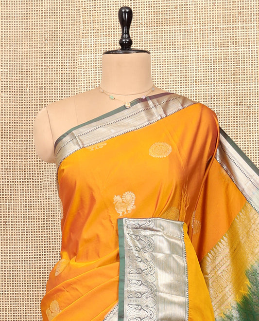 Yellow Budget Silk Saree, Artfully Detailed with Peacock-Chakram Buttas, Complemented by Contrast Traditional Zari Border, Pallu of Jaal Designs, and Contrast Blouse