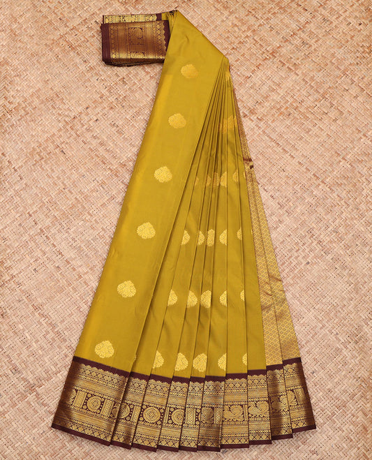 Green Budget Silk Saree, Sparsely Woven with Buttas All Over Its Body, Complemented by a Contrast Traditional Zari Border of Peacock-Chakram Designs, Pallu of Jaal Zari Designs, and Paired with a Contrast Blouse