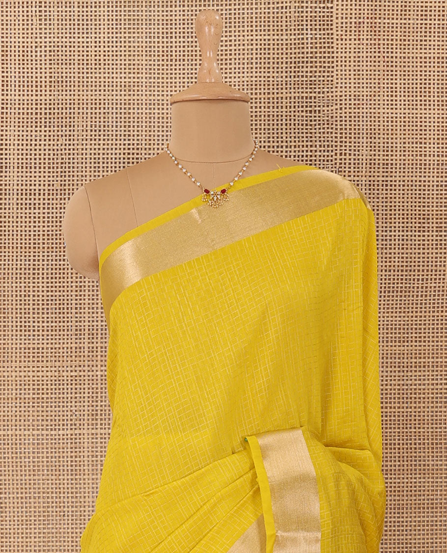 Yellow checked Assam silk saree, bavanji border, and pallu of stripes