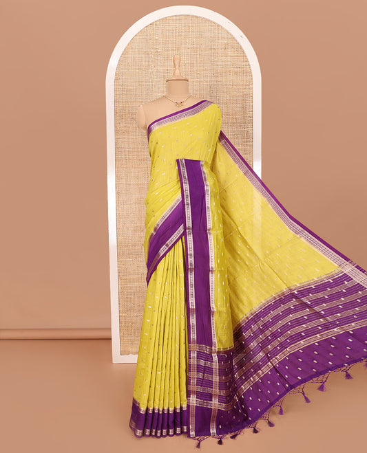 Elegant Yellow Assam Silk Saree Features Zari Buttas All Over the Body, Complemented by Contrast Traditional Zari Design Border, Pallu Elevated with Zari Stripes, and Paired with a Contrast Blouse