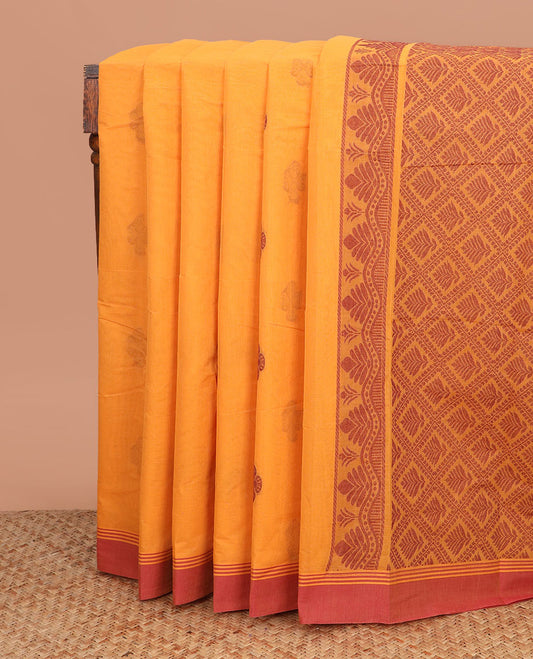 Orange buttas kanchi cotton saree, contrast plain border, and jaal pallu