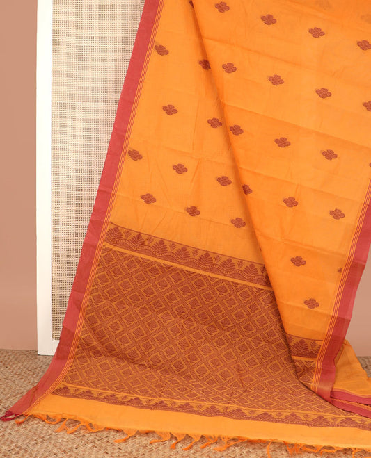 Orange buttas kanchi cotton saree, contrast plain border, and jaal pallu
