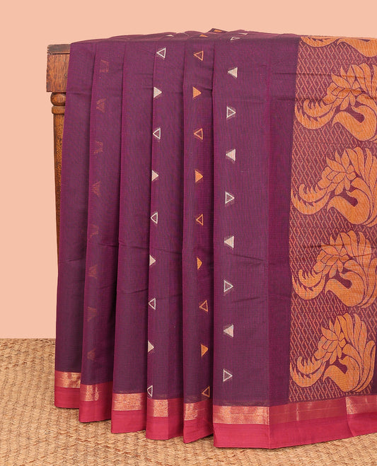 Purple Kanchi Cotton Saree, Gleamed Up with Temple Buttas All Over Its Body, Complemented by a Contrast Border, Pallu Depicts Floral Designs, and Paired with a Matching Blouse