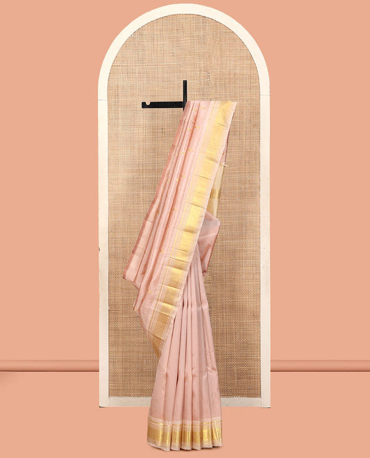 Light Sandal Kanchipuram Silk Saree, Subtly Sparkled with Buttas, a Contrast One-Sided Border of Panner Sombu, Banaras, Muthu, and Jaal Designs, a Zari Design Pallu, and No Blouse