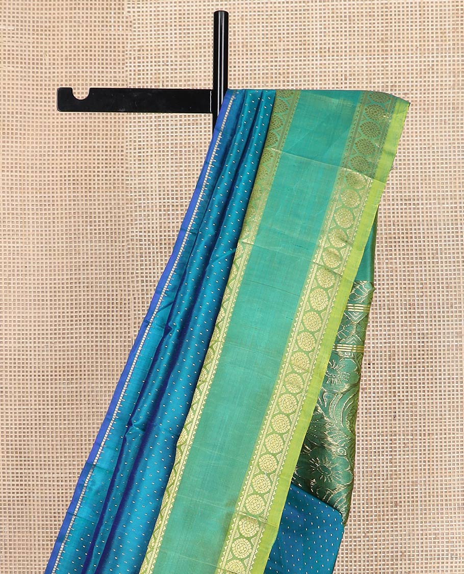 Blue buttas kanchipuram silk saree, contrast rettai pettu one-sided zari border of rekku,banaras & chakram & floral design pallu