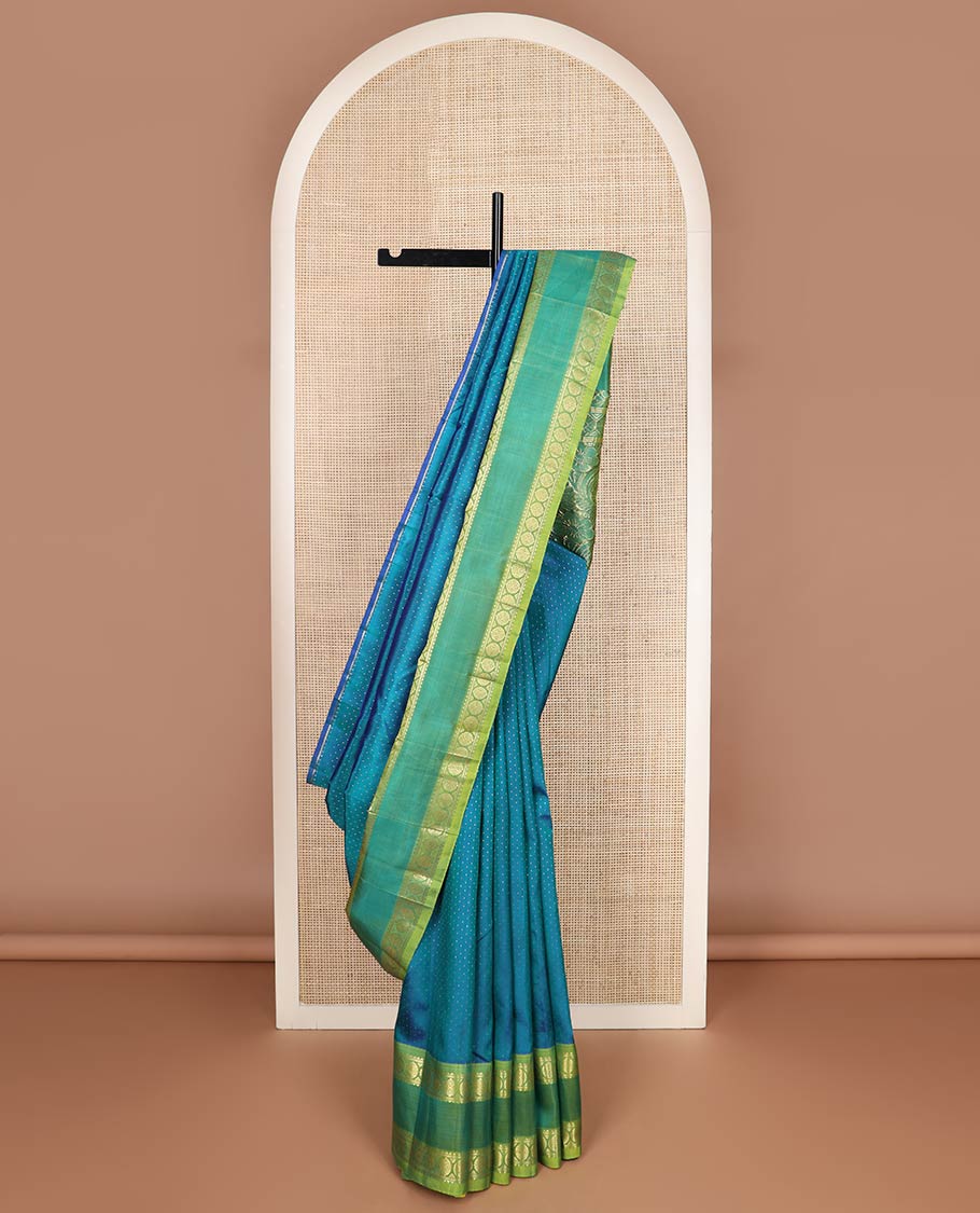 Blue buttas kanchipuram silk saree, contrast rettai pettu one-sided zari border of rekku,banaras & chakram & floral design pallu