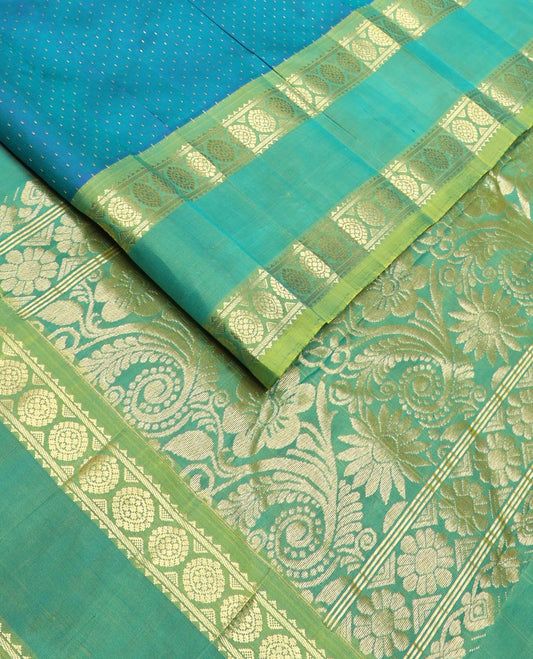 Blue buttas kanchipuram silk saree, contrast rettai pettu one-sided zari border of rekku,banaras & chakram & floral design pallu