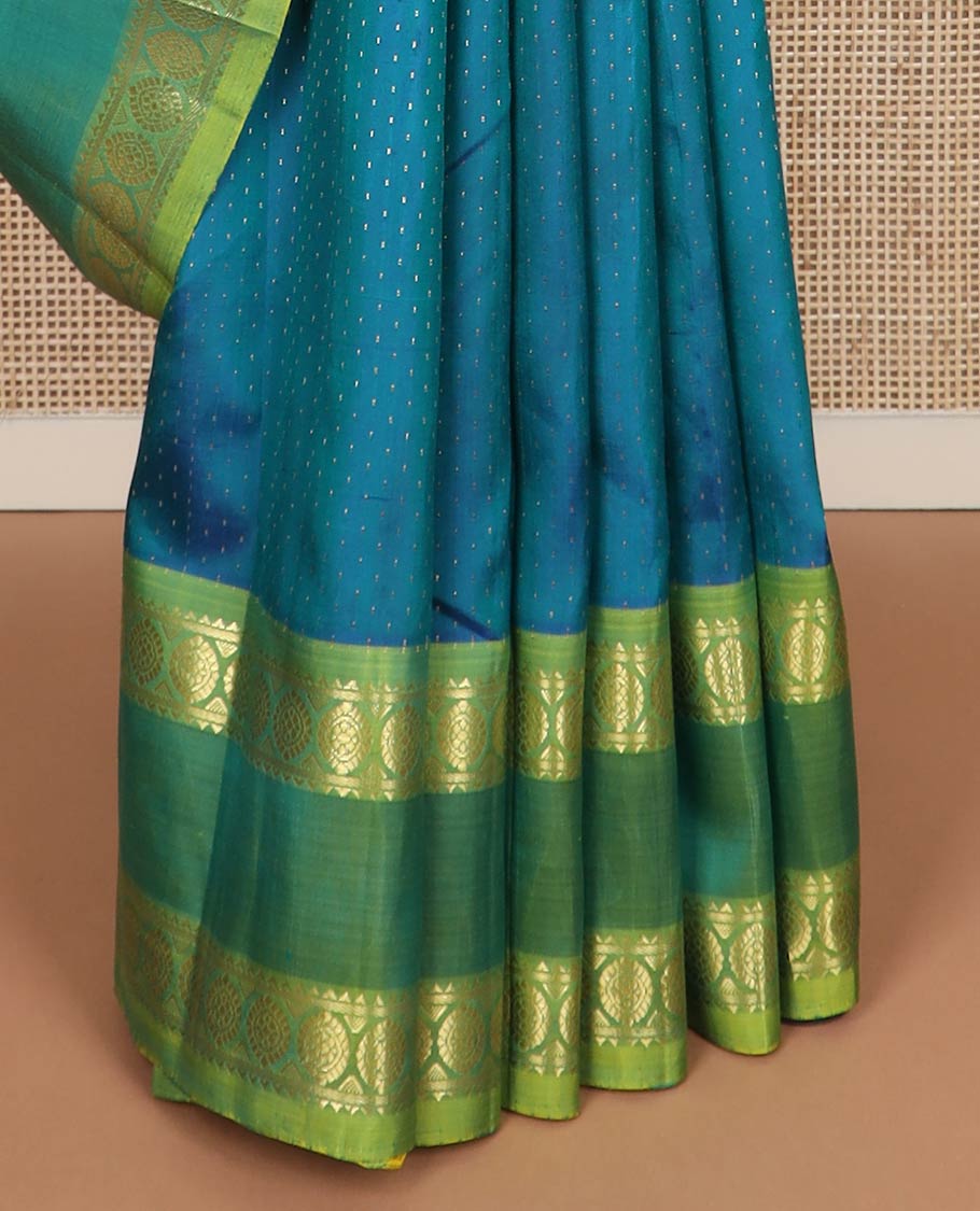 Blue buttas kanchipuram silk saree, contrast rettai pettu one-sided zari border of rekku,banaras & chakram & floral design pallu