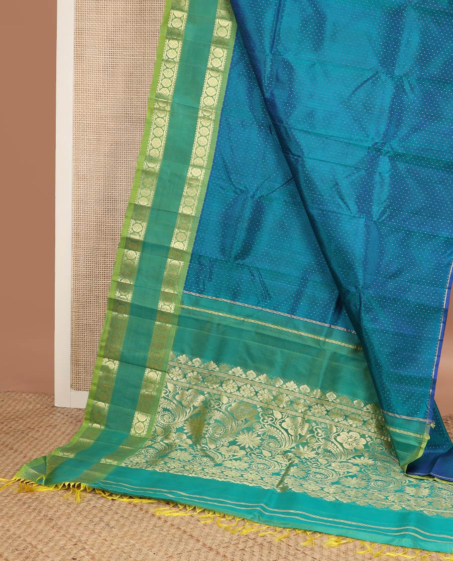 Blue buttas kanchipuram silk saree, contrast rettai pettu one-sided zari border of rekku,banaras & chakram & floral design pallu