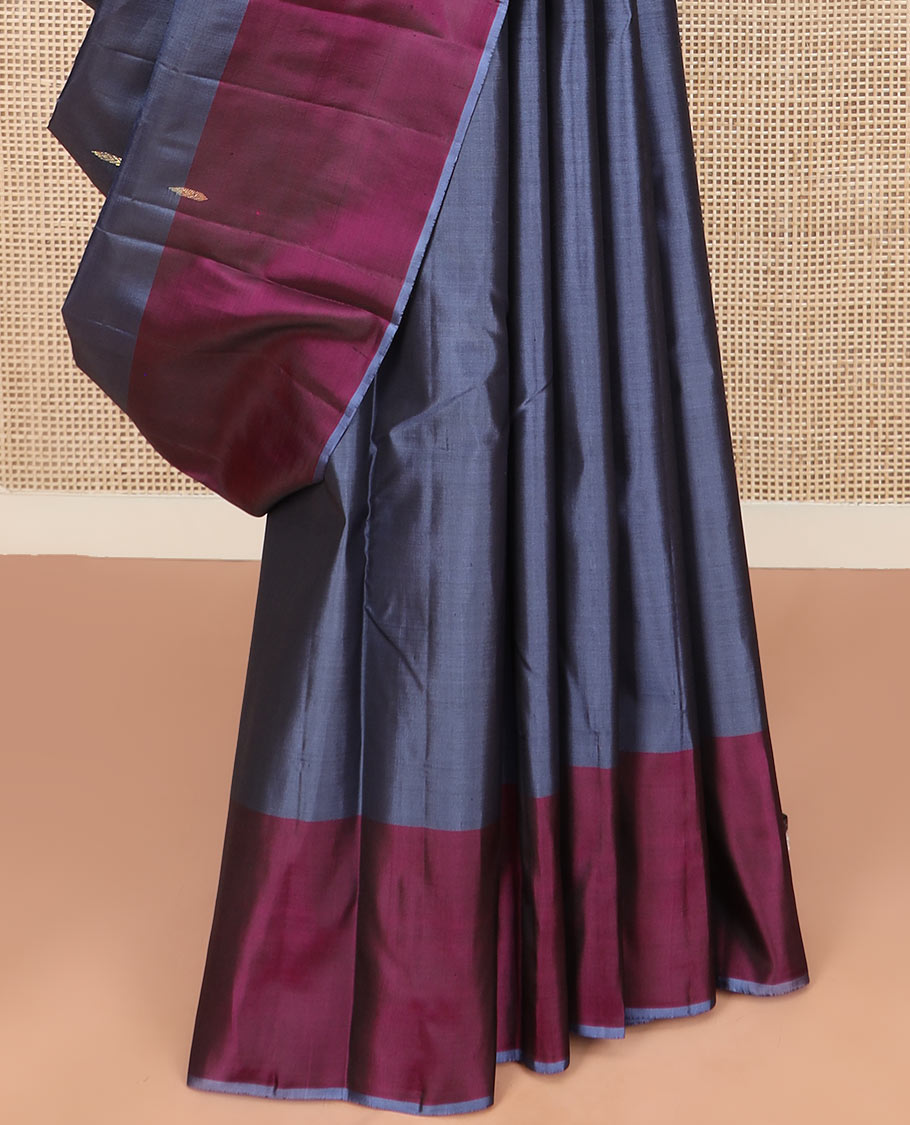 Grey Kanchipuram Silk Saree Highlighted with Zari Buttas, a Contrast Border of Floral Designs, a Subtle Woven Pallu of Floral Designs, and a Contrast Plain Blouse