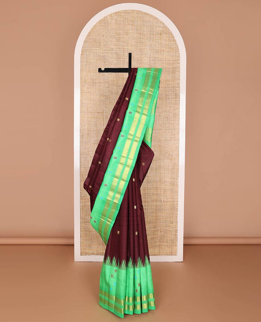 Maroon kancheepuram silk saree with mayil zari buttas, contrast one-sided thazampoo reku border of mayil, muthu & jaal design & pallu of mayil & pillaiyar mokku designs