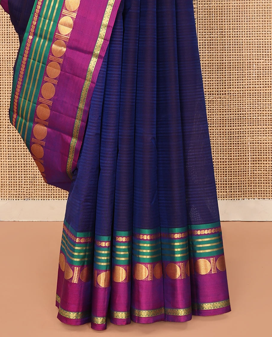 Blue Kanchipuram Silk Saree, Subtly Sparkled with Stripes All Over Its Body, Complemented by a Contrast Border of Manga, Banaras, Poun, and Rettai Neli Designs, Pallu of Zari Stripes, and Paired with a Contrast Blouse