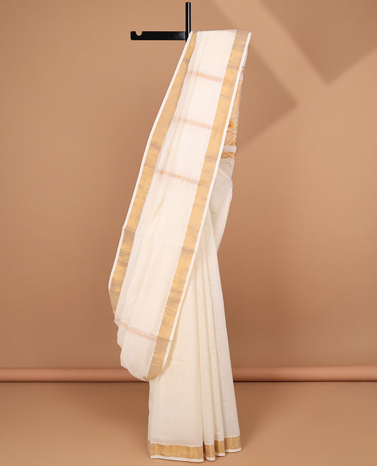 Cream kerala saree with zari stripes, plain border & pallu of peacock designs