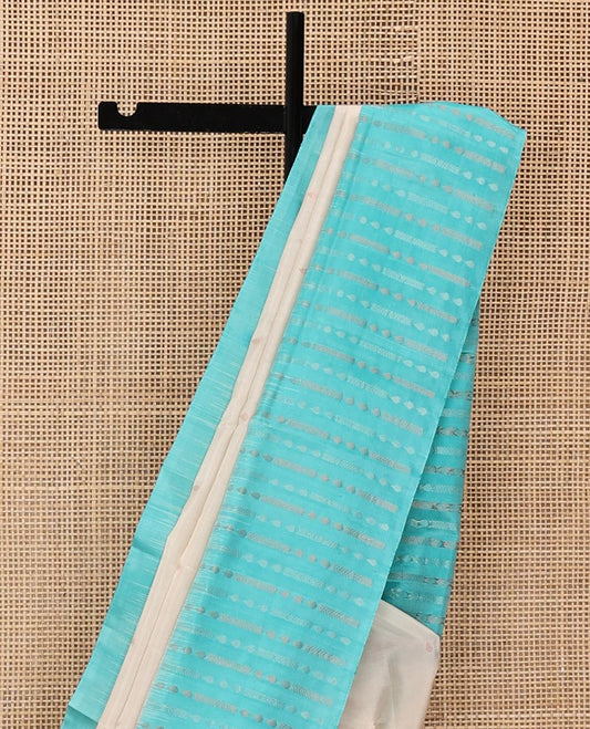 Off-White Mayuri Soft Silk Saree, Sparsely Sparkled with Buttas on Its Body, Complemented by a Contrast Border of Geometric Patterns, Pallu Steeped with Geometric Patterns, and Paired with a Contrast Blouse