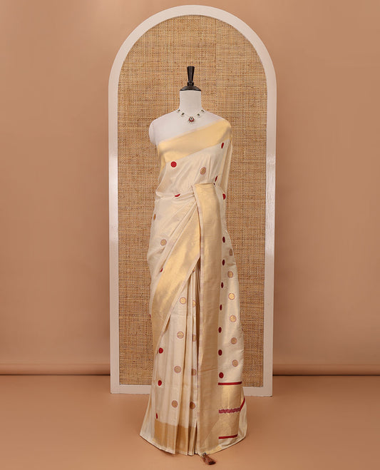 Cream small red polka dots banarasi tissue saree, zari border, pallu of red polka dots & running plain blouse