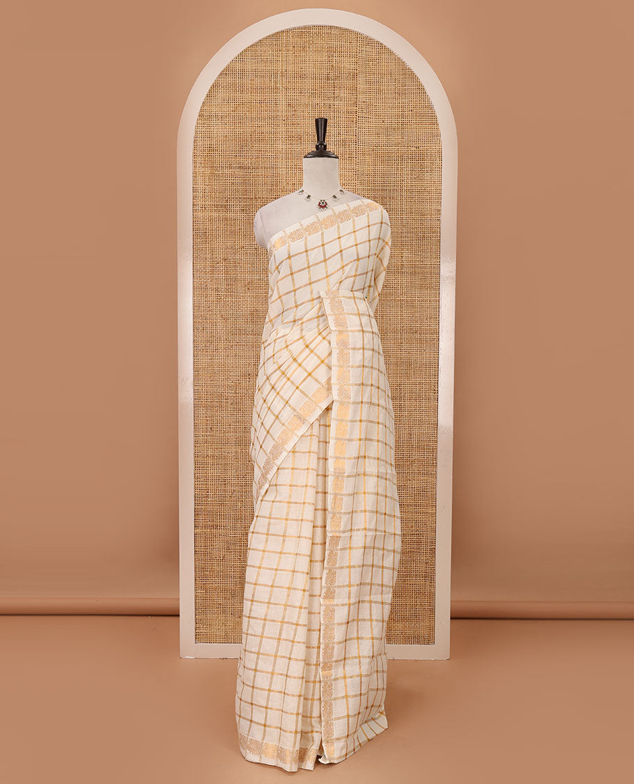 Cream golden zari checked sungudi cotton saree, zari border of peacock motifs & contrast red checked peacock motif blouse