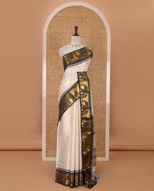 White checked semi-tafeta saree, contrast temple zari elephant motifs black color border, zari-rich pallu & contrast checked zari border blouse