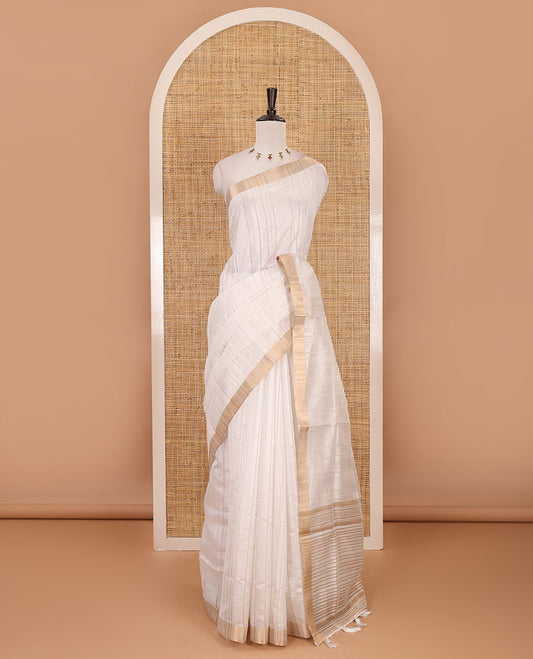 Cream striped tissue saree, gold zari piping border, zari striped pallu & plain blouse