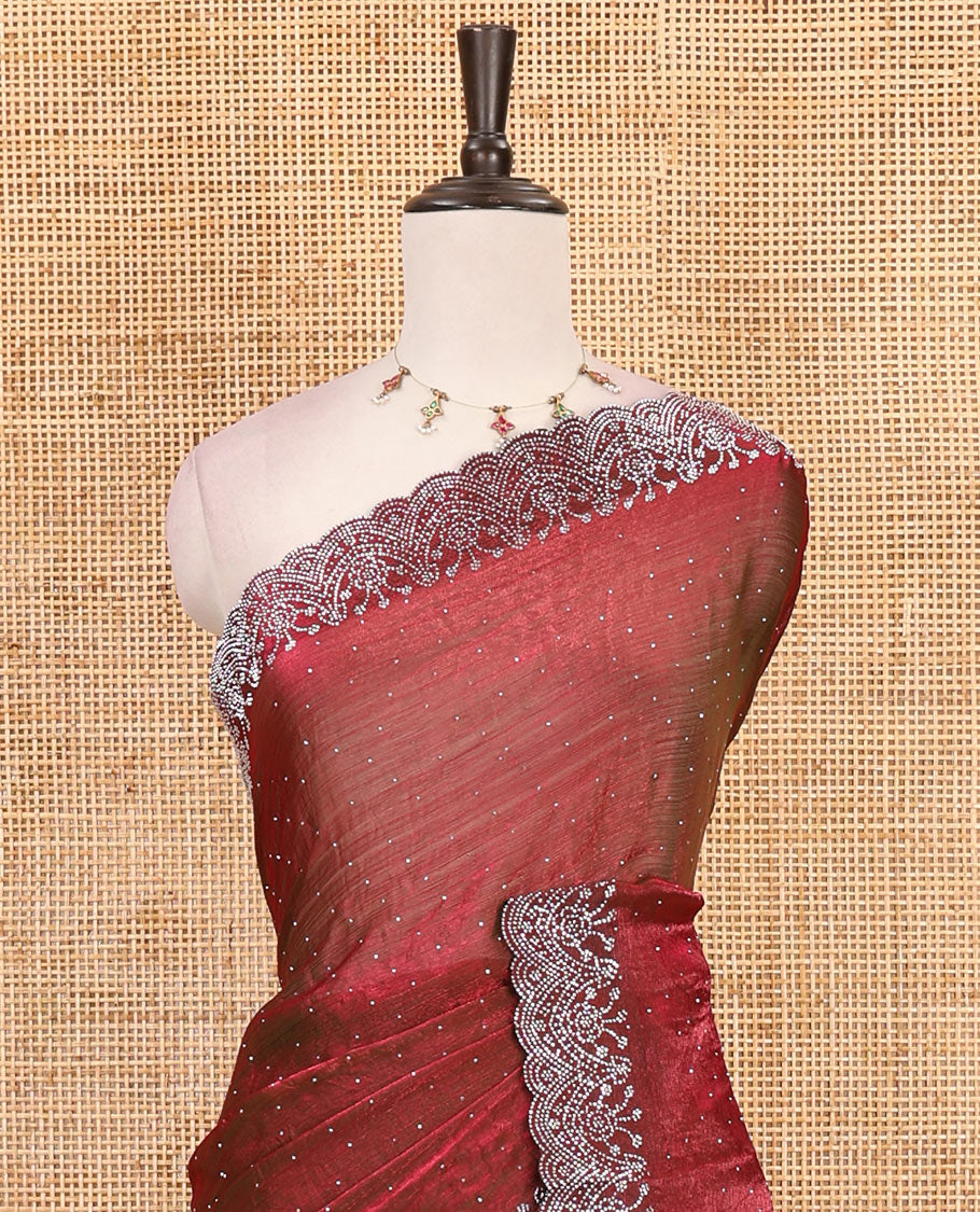 Maroon Swarovski crystal stone embedded fendy chiffon saree, scallop border accentuated with floral and scallop design in Swarovski stones