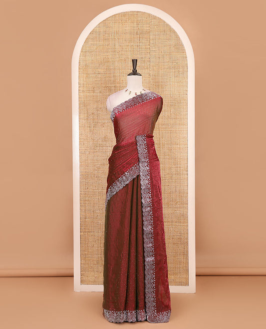Maroon Swarovski crystal stone embedded fendy chiffon saree, scallop border accentuated with floral and scallop design in Swarovski stones