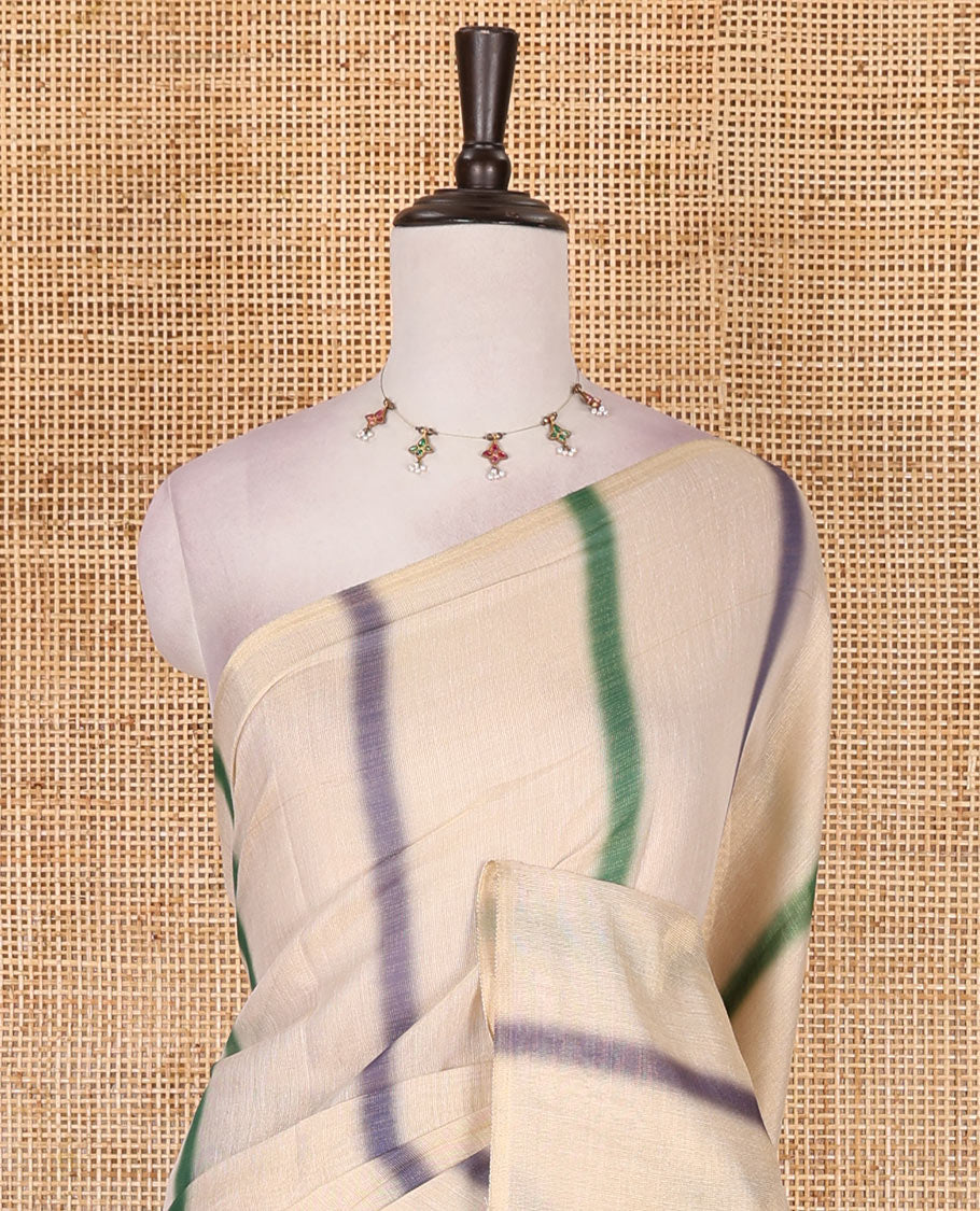 Borderless cream, colorful striped tissue saree, unique motifs printed green color blouse