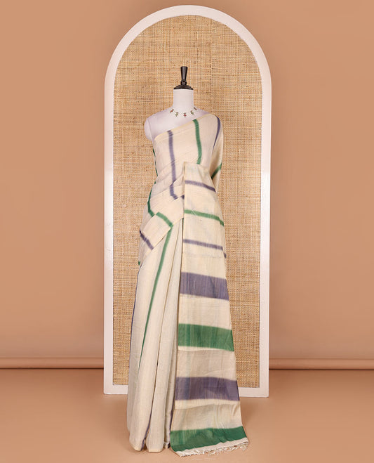 Borderless cream, colorful striped tissue saree, unique motifs printed green color blouse