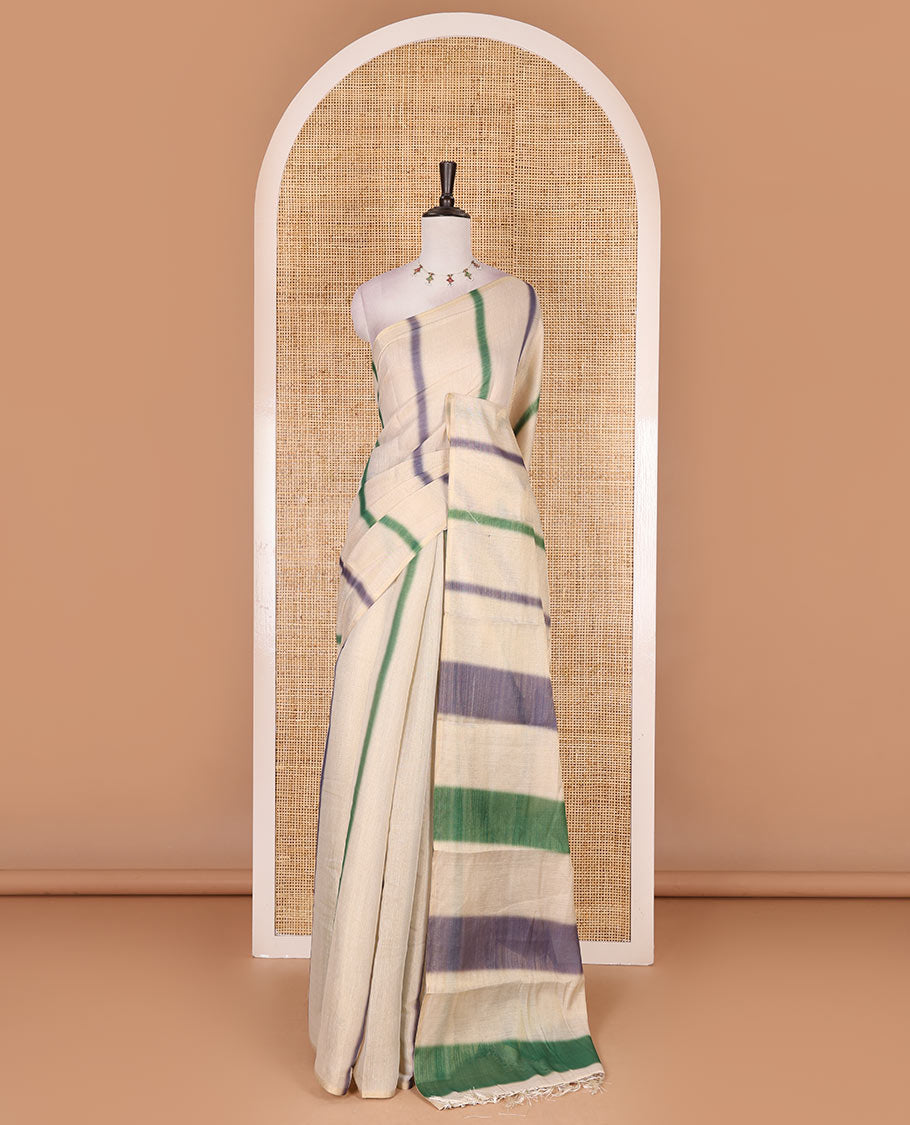 Borderless cream, colorful striped tissue saree, unique motifs printed green color blouse