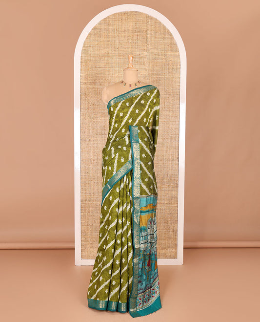 Green batik style lehariya stripes printed muslin silk saree, contrast peacock zari woven border, Mughal inspired painting style motifs printed pallu and a contrast blouse