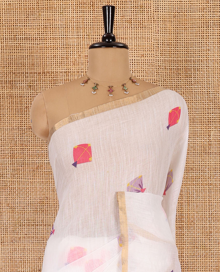 White kite motifs printed linen cotton saree, piping zari border, kite motifs printed pallu, and a contrast ikkat style printed blouse