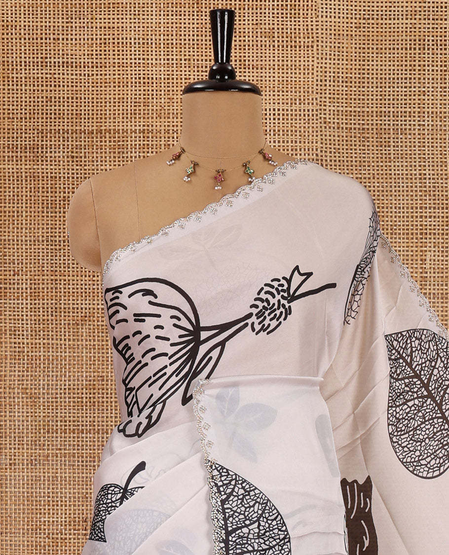 Cream and black floral, butterflies and horizontal striped printed satin crepe saree, stone work scallop border, and a contrast printed stone work blouse
